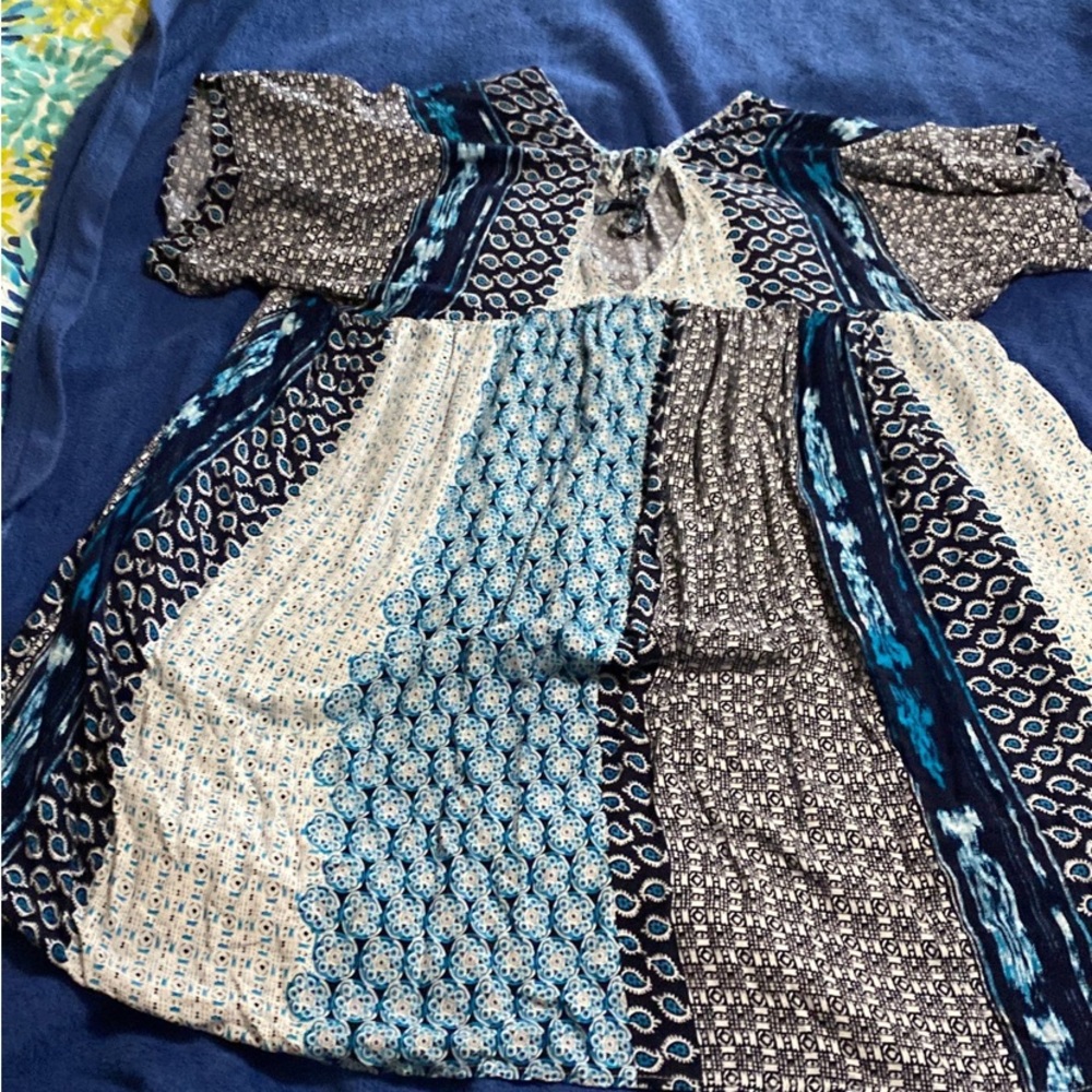 I think this would be a tunic, it would fall below my tush